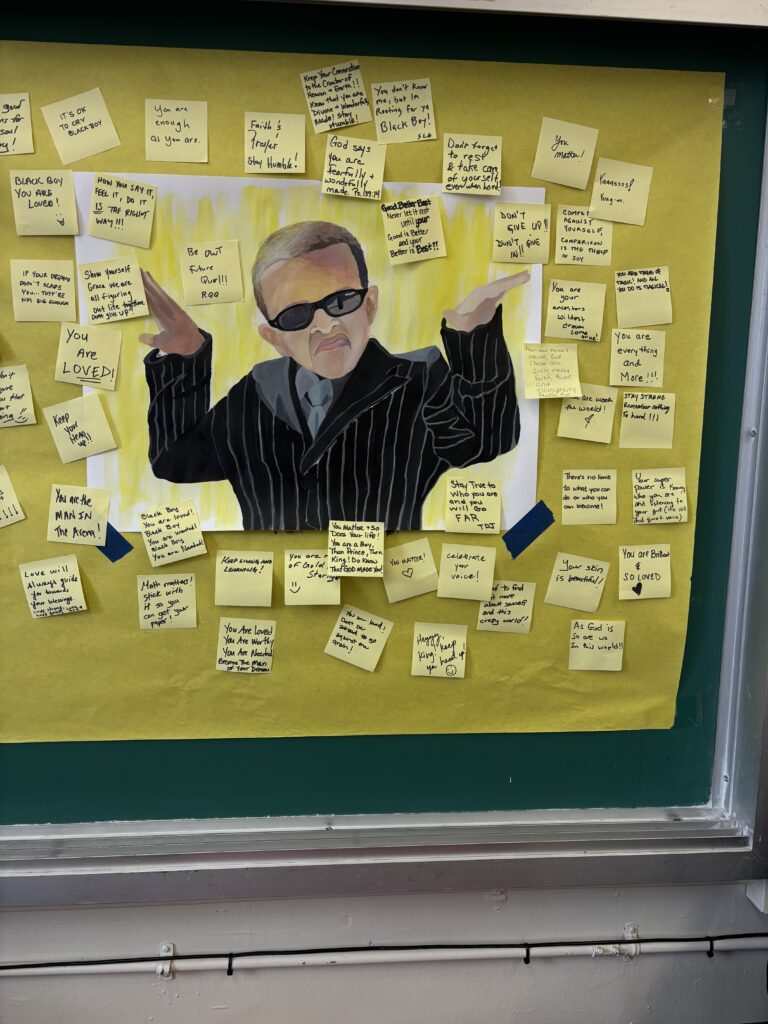 Yellow sticky notes surround an image of a Black boy