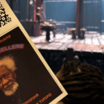 a theatre program in front of a stage