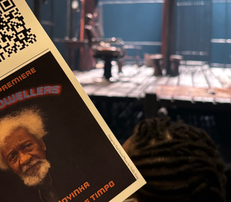 a theatre program in front of a stage