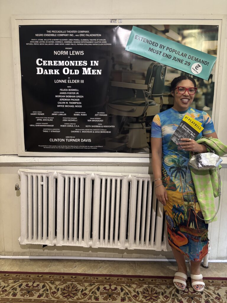 a woman stands in front of a poster for the show "ceremonies in dark old men"