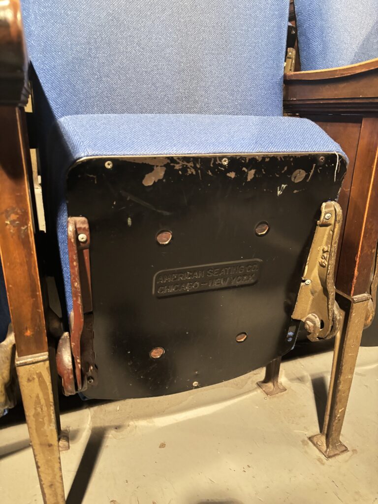 a fold down theatre chair