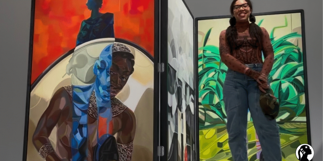 a woman stands in front of a large colorful artwork
