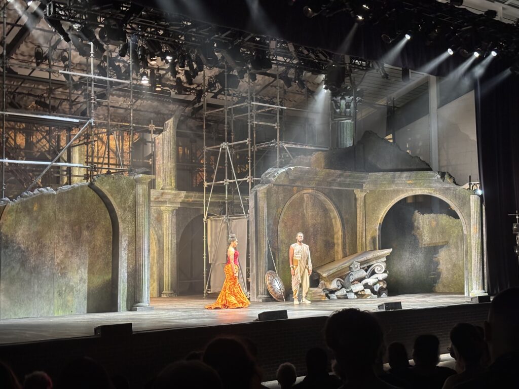 Performers stand on the stage