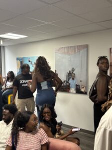 a room of people and art