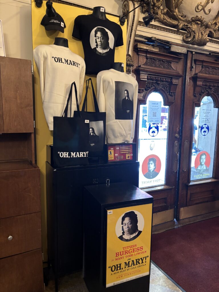 Branded 'Oh, Mary' shirts, sweaters, totes, pens, and hats