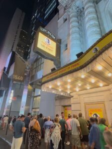 People stand outside of the theater after Tuesday's performance