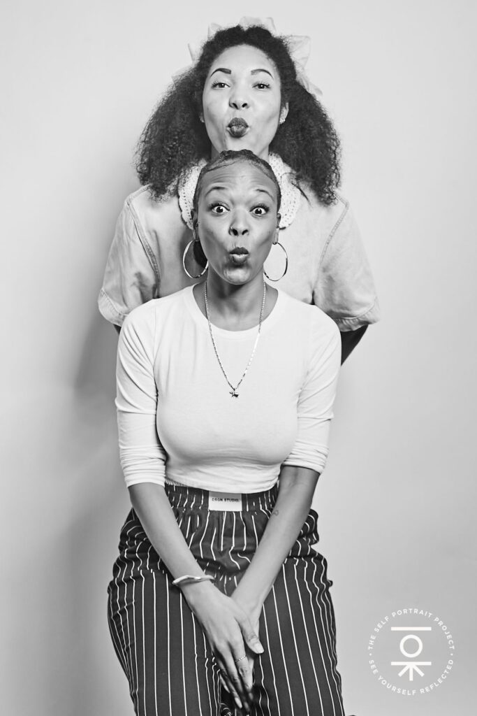 Two women make fish faces (black and white photo)