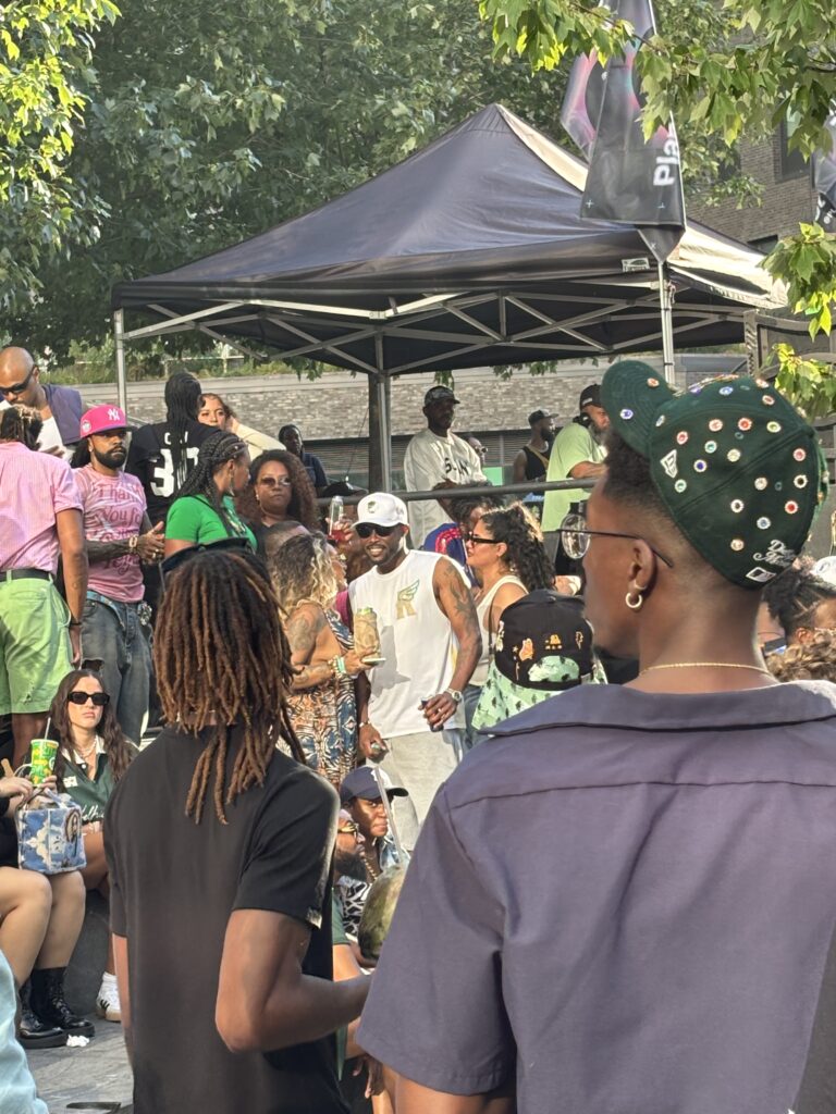 Young, black people in unique outfits talk to each other