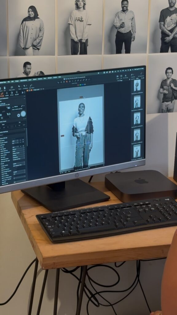 A computer monitor shows one of Natali's black and white photos in a photo editing program